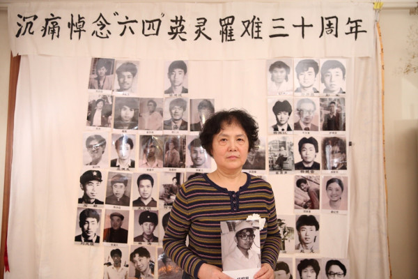 You Weijie, widow of Yang Minghu, holding his portrait at the Tiananmen Mothers’ 30th anniversary commemoration of June Fourth victims, March 2019