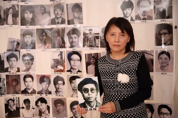 Duan Changqi(段昌琦), sister of Duan Changlong, holding his portrait at the Tiananmen Mothers 30th anniversary commemoration of June Fourth victims, March 2019