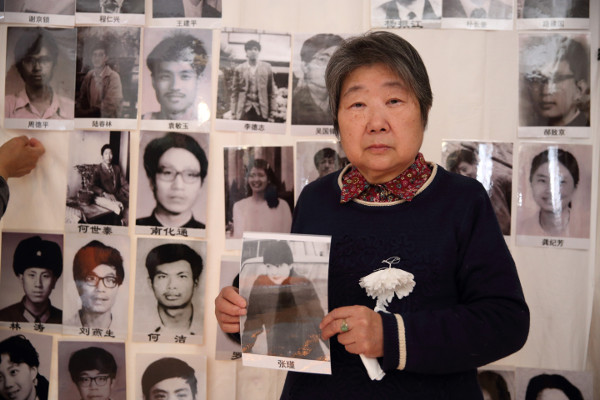 Ma Xueqin, mother of Zhang Jin, holding her portrait at the Tiananmen Mothers’ 30th anniversary commemoration of June Fourth victims, March 2019